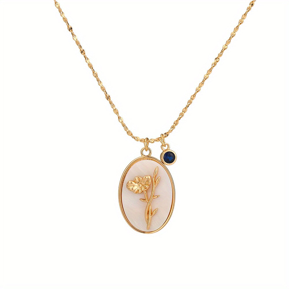 A Three-Dimensional Oval-Shaped Pendant Necklace Made of Golden with a Birthstone And White Mother-Of-Pearl, Featuring a December Flower Design